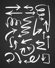 Vector illustration: Hand drawn textured black arrows on chalkboard background.
