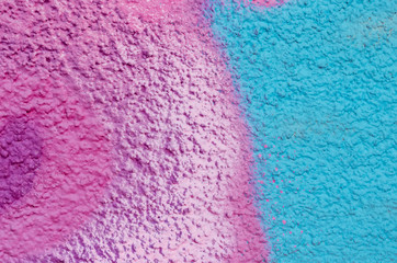 Beautiful bright colorful street art graffiti background. Abstract creative spray drawing fashion colors on the walls of the city. Urban Culture, black ,blue, purple , violet , neon texture