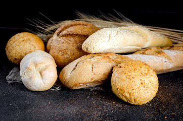 Assortment of baked goods on old dark wooden table