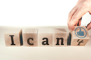 changing text I can not to I can on wooden blocks, motivation concept