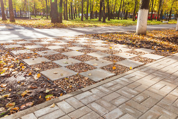 Reconstruction of concrete tile walkways in a public park.