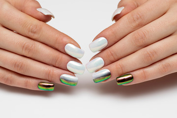 Obraz na płótnie Canvas Holiday manicure. White rub on square nails closeup. Black and green manicure. Black and white оmbre