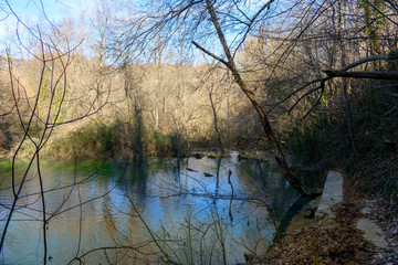 Stone path on the shores of a small lake in Skra in Greece