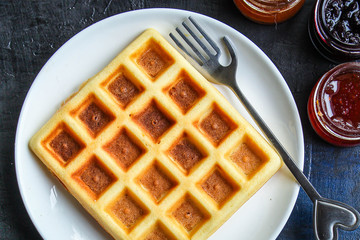 Belgian or Viennese waffles (delicious sweet dish, dessert snack) menu concept. background. top view. copy space