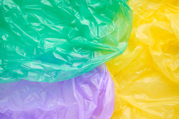 Close up Texture of a multicolor Plastic garbage Bag. Green Poly
