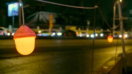 Fototapeta na wymiar construction lantern by the road in the evening