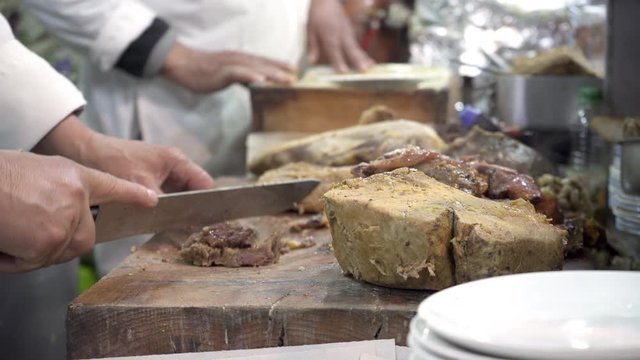 Preparing cow's intestines in Jamma El Fna Market in Marrakesh, Morokko