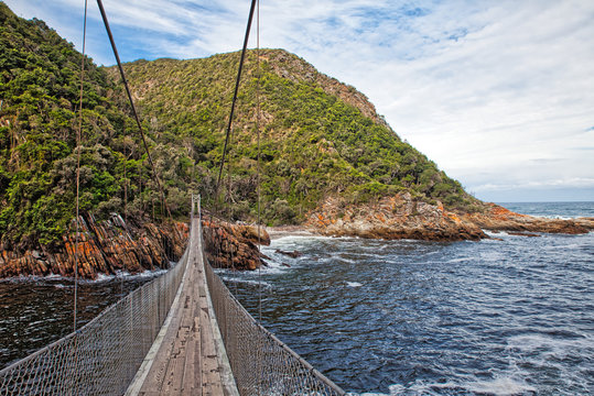 swinging suspension bridge over the sea
