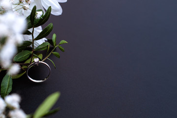 engagement ring with white flowers and lots of copy space for your text or invitation. Wedding...
