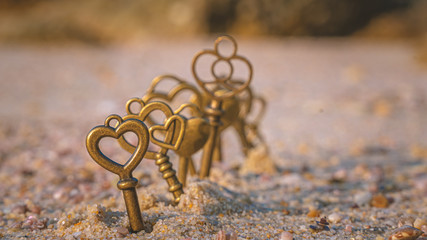 Brass Keys On Sand Beach