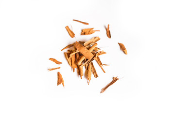 Closeup of a pile of organic cinnamon sticks isolated on a white background
