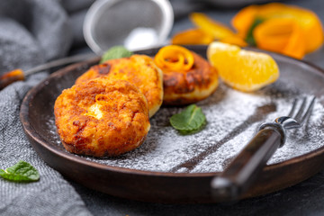 Homemade cottage cheese pancakes with powdered sugar.