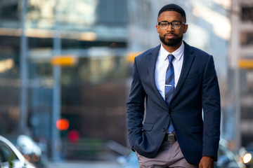 Stylish handsome modern business executive, african american banker, financial representative, suit and tie with smart glasses