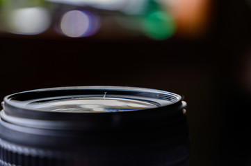 Dust on open camera lens glass