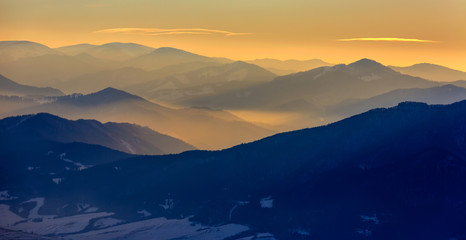 evening landscape in mountains with sunset light in mountain valley