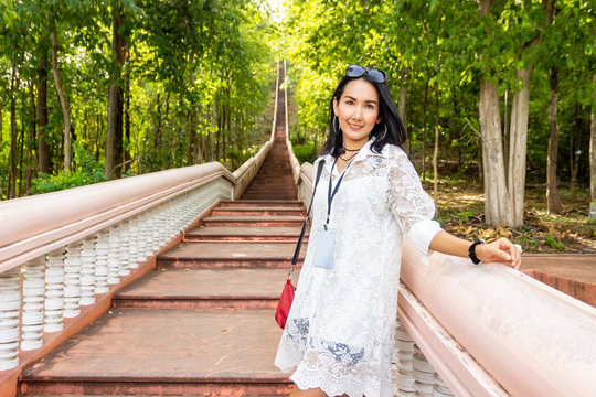 Happiness Means Everything, Young Asian Woman Smile at Khao Kradong Forest Park, The long extinct volcano in Buriram, Thailand.