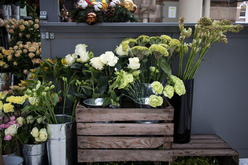 Selection of green flowers in bouquets for sale in flower shop on the street