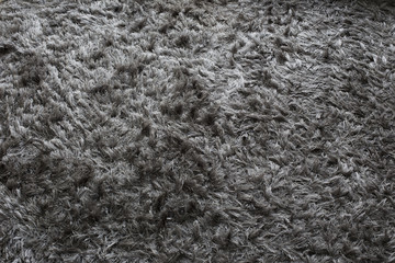 background of gray long faux carpet