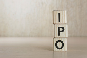 Text IPO on wood cube block, stock investment concept.