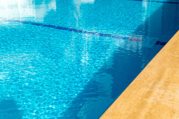 Pool side background with copy space. Swimming pool during sunny day.
