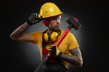 the male construction worker with a sledgehammer