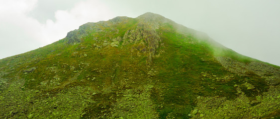 green mountain in the fog. nature landscape