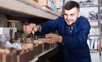 worker checking small details for sanitary engineering in workshop
