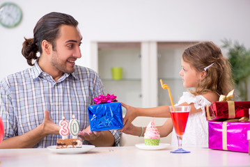 Father celebrating birthday with his daughter