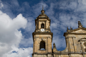 Fototapeta na wymiar Church steeple against blue sky with clouds