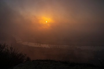 Sunrise time on Radobyl hill over valley of river Labe and Litomerice town