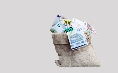 Fotobehang money in a bag isolated on white © izzetugutmen