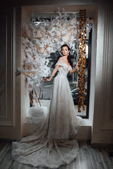 Fashion model or princess at prom. Wedding fashion and beauty salon. Woman. Sexy girl in white dress with stylish hair. Woman posing in beautiful scenery