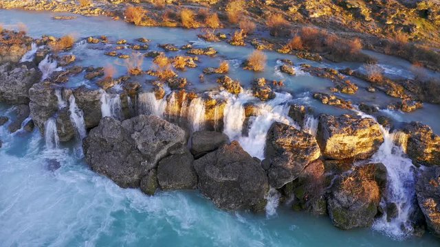 Frothy water in cascades and whitewater rapids at the waterfall Niagara on Cijevna (Cem) river near Podgorica and Tuzi in Montenegro, after heavy rains in wet season, at sunset.