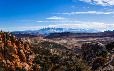 Fototapeta premium Sunset on the desert at Arches National Park and La Sal Mountains in the background