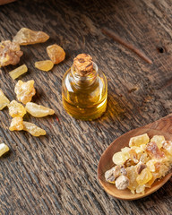 A bottle of frankincense essential oil with frankincense resin