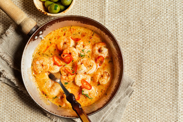 Scampi fried in fat with garlic and chili