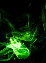 Green smoke on black background