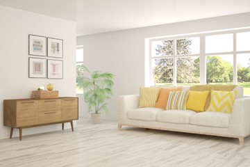 Stylish room in white color with sofa and summer landscape in window. Scandinavian interior design. 3D illustration