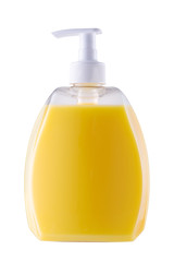 Yellow bottle of liquid soap or gel with a pump on a white isolated background close-up.