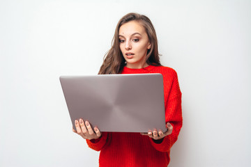 Girl with laptop at home.