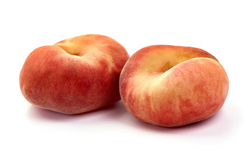 Flat Peaches, ripe nectarines, isolated on white background