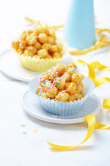 Struffoli napoletani Carnival  italian fritters with honey and sprinkles.