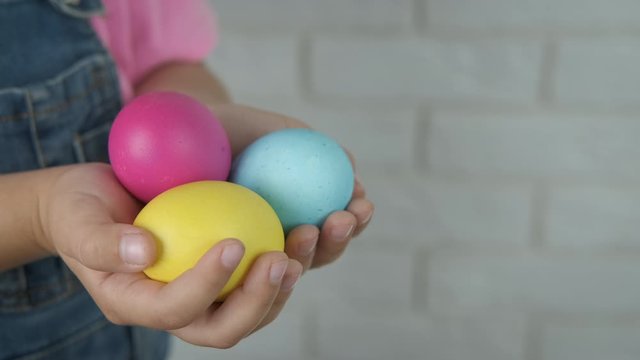 Painted eggs in the hand.