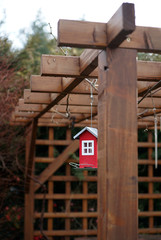 bird feeder hanging on the gazebo in the garden