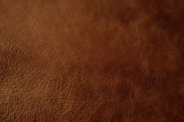 Fototapeta premium Brown leather texture background, genuine leather, top view. Brown leather texture - skin animal. Texture for design. Can be used as background wallpaper and background for design-works.