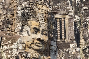 Fototapeta premium Mural Detail on Richly Decorated Bayon Khmer Temple at Angkor Wat Ruins, World Heritage Site near Siem Reap, Cambodia