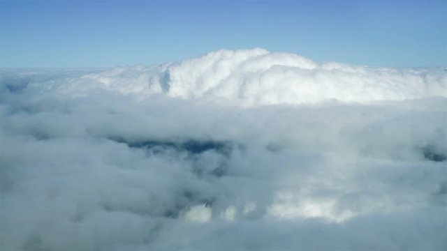 Aerial shot above the clouds in 4K