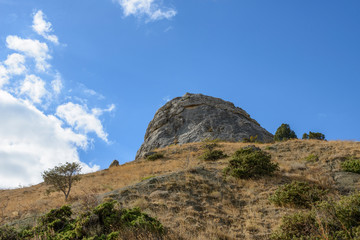 Famous Sugar Head rock in Sudak town, Crimea, Russia.
