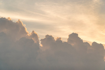 Big cumulus clouds on sky during a sunset