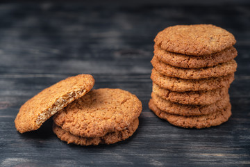 Homemade oatmeal cookies on a wooden background. Great healthy breakfast.